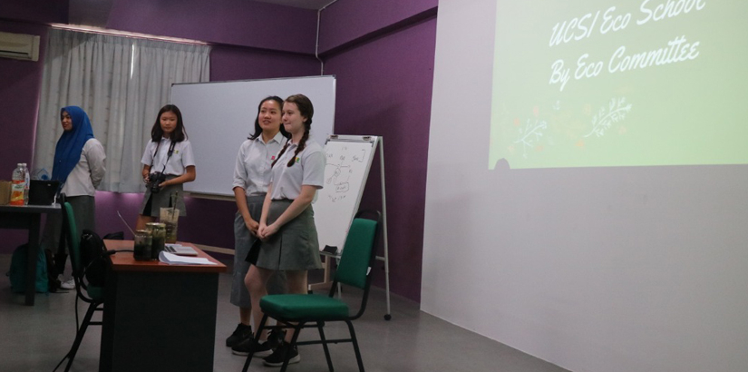 UCSI SH students presenting on Eco-School activities during the visit to Melaka International School.
